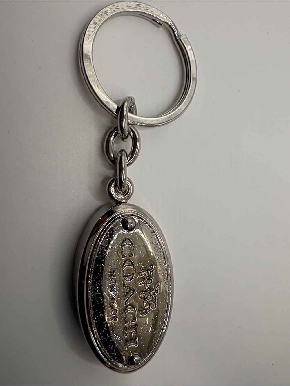 Coach Silver Oval Logo Keychain with Glitter Detail